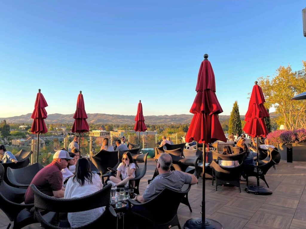 Sky and Vine Happy Hour Patio with Umbrellas